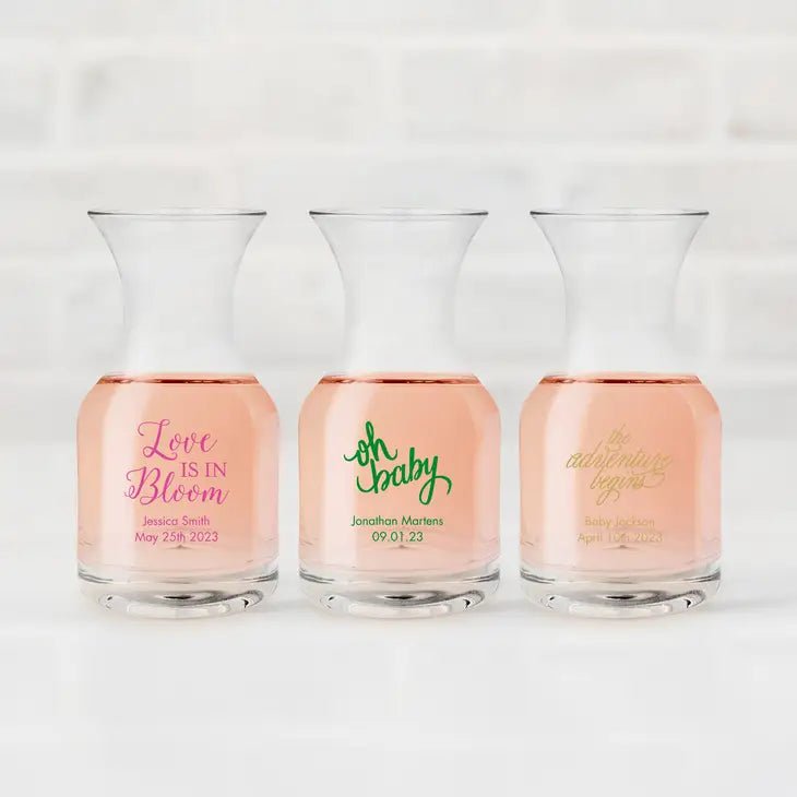 https://www.foreverweddingfavors.com/cdn/shop/products/baby-shower-5-oz-individual-glass-wine-carafe-167645_1200x.webp?v=1686402739