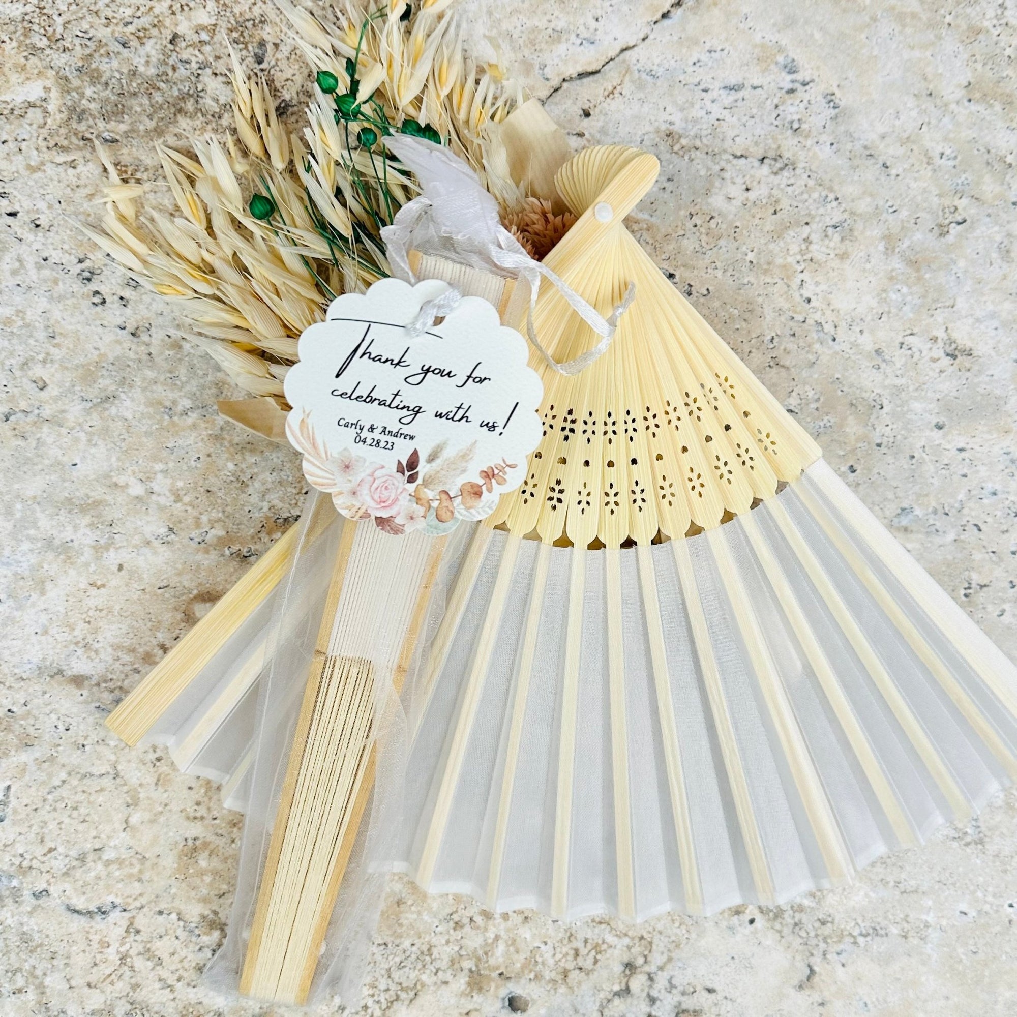 Provided wedding fans for guests to stay cool during the ceremony